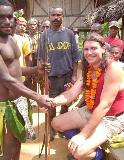 Jim Thomas with villagers